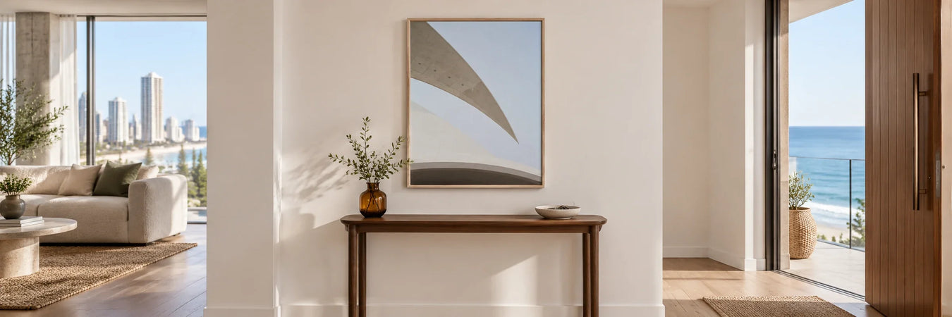 Emma Street Architectural I print above a walnut console in a coastal entry