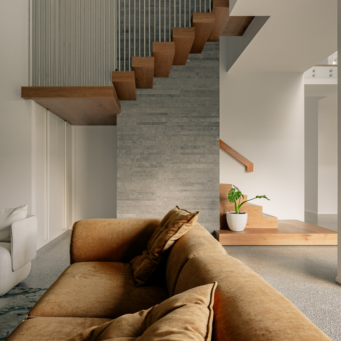 Desert Calm Sofa - Manissa Caramel, styled beside a timber staircase