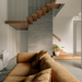 Desert Calm Sofa - Manissa Caramel, styled beside a timber staircase