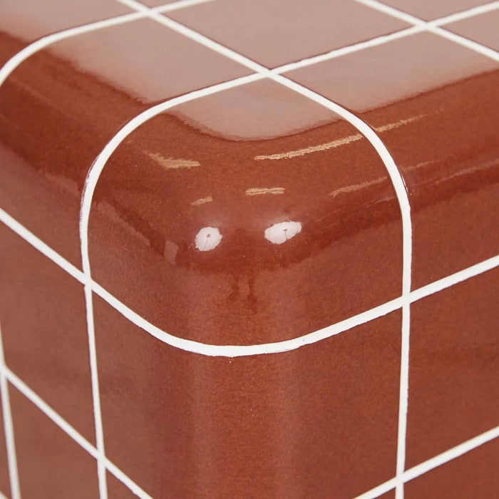 Close-up of the rounded top corner of the Andalusian Mosaic Side Table in red glaze