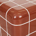 Close-up of the rounded top corner of the Andalusian Mosaic Side Table in red glaze