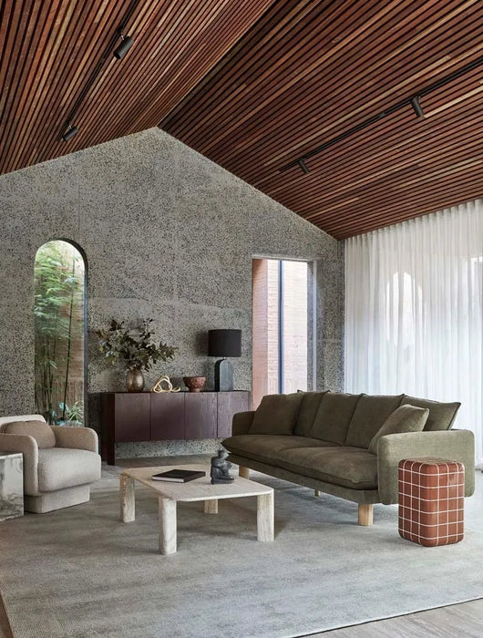 Andalusian Mosaic Side Table in red glaze beside an olive sofa in a living room with a pitched timber ceiling