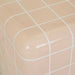 Close-up of a rounded corner of the Andalusian Mosaic Side Table in pink glaze