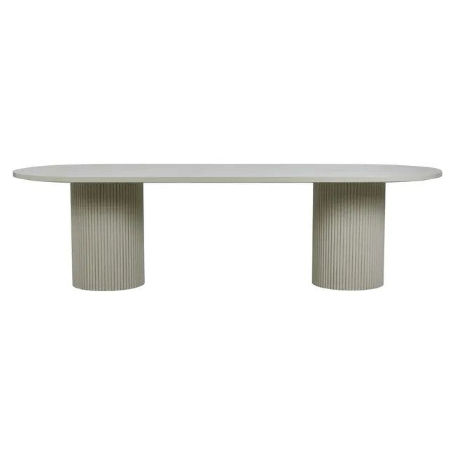Benjamin Ripple Oval Dining Table in putty with two ribbed pedestal bases, side view