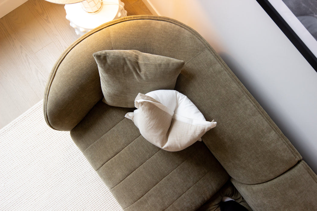 Juniper Pearl Sofa - Copeland Olive, seen from above in a living room