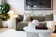 Juniper Pearl Sofa - Copeland Olive, styled in a living room with a marble coffee table