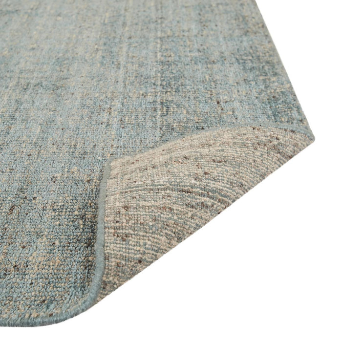Tepih Dune Rug in Sacramento, a corner folded back to show the underside