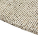 Tepih Dune Round Rug in Oatmeal, close-up of the flecked pile and edge