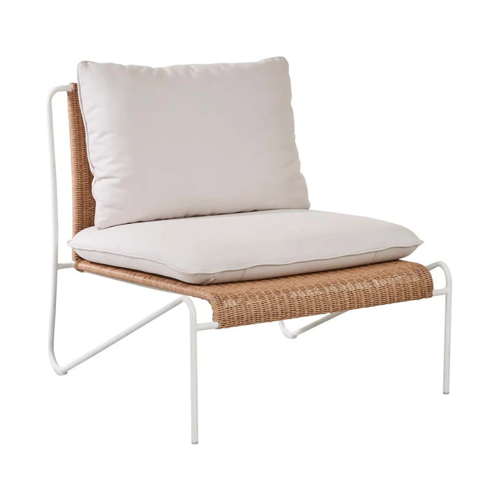 Blossom Armchair with a bone frame and cream cushions, three-quarter view