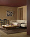Anni Floor Rug in Chocolate, styled in a living room with a cream sofa, low timber coffee table and dark chairs