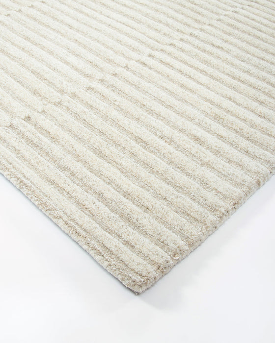 Anni Floor Rug in Oat, close-up of a corner showing the edge and wool pile