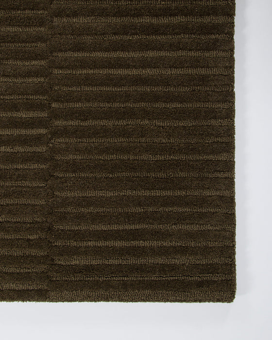 Anni Floor Rug in Mangrove, close-up of a corner showing the edge and wool pile