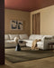 Anni Floor Rug in Mangrove, styled in a living room with a cream modular sofa and round black coffee table