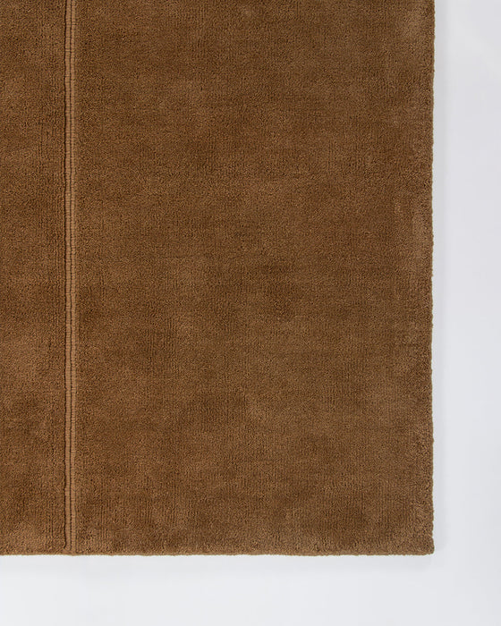 Bastion Floor Rug in Hazelnut, close-up of a corner showing the edge and wool pile