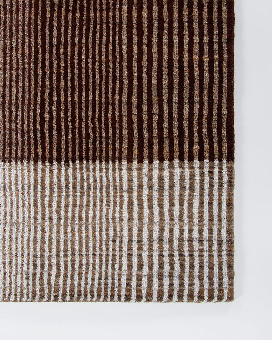 Bedrock Floor Rug in Claret, close-up of a corner showing the edge and recycled PET pile