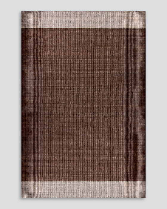 Bedrock Floor Rug in Claret, the whole rug shown flat on a plain background