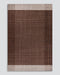 Bedrock Floor Rug in Claret, the whole rug shown flat on a plain background