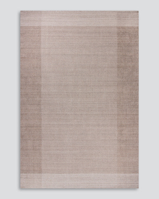 Bedrock Floor Rug in Sand, the whole rug shown flat on a plain background