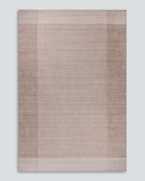 Bedrock Floor Rug in Sand, the whole rug shown flat on a plain background