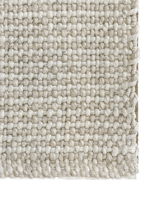 Kansas Floor Rug in Oat/Natural, close-up of a corner showing the edge and wool and viscose pile
