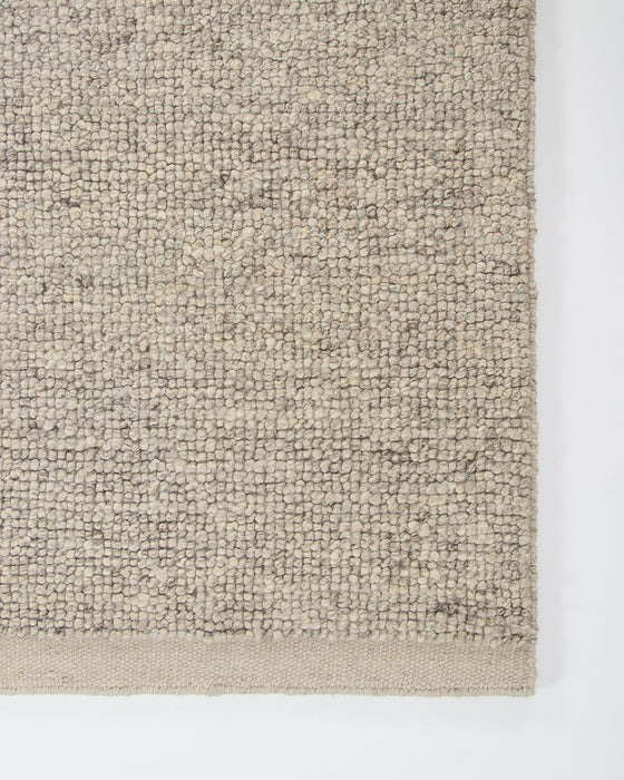 Clifton Floor Rug in Ash, close-up of a corner showing the edge and wool pile