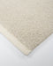 Clifton Floor Rug in Bone, close-up of a corner showing the edge and wool pile