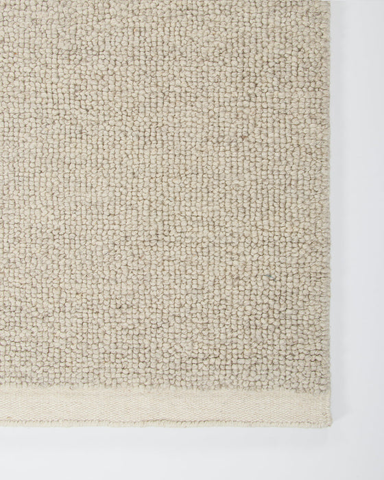 Clifton Floor Rug in Bone, close-up of a corner showing the edge and wool pile