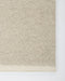 Clifton Floor Rug in Bone, close-up of a corner showing the edge and wool pile