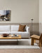 Clifton Floor Rug in Bone, styled in a living room with a white sofa, timber coffee table and lounge chair
