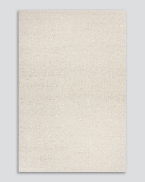 Clifton Floor Rug in Ivory, the whole rug shown flat on a plain background