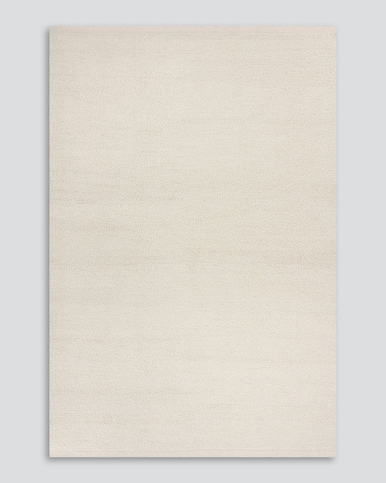 Clifton Floor Rug in Ivory, the whole rug shown flat on a plain background