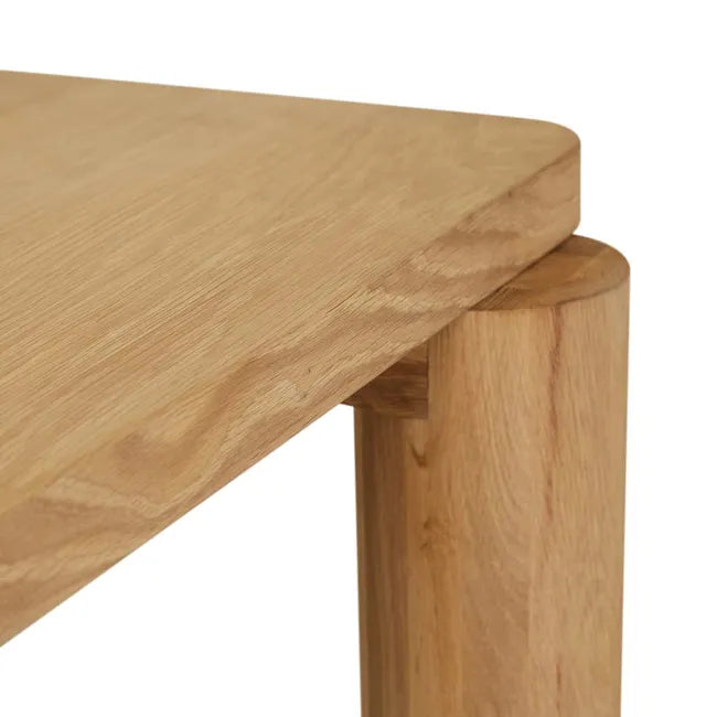 Close-up of where a round oak leg meets the tabletop, Flint Dining Table