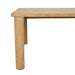 Close-up of a round oak leg and the tabletop corner of the Flint Dining Table