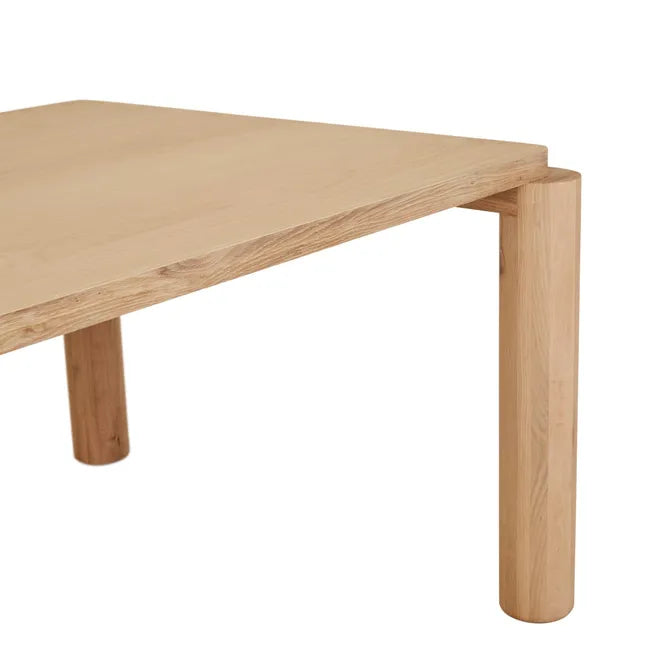 Close-up of a tabletop corner and round oak leg, Flint Dining Table
