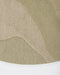 Edgewater Round Floor Rug in Pistachio, close-up of the curved edge and wool weave