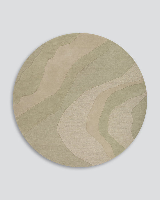 Edgewater Round Floor Rug in Pistachio, the whole round rug shown flat on a plain background