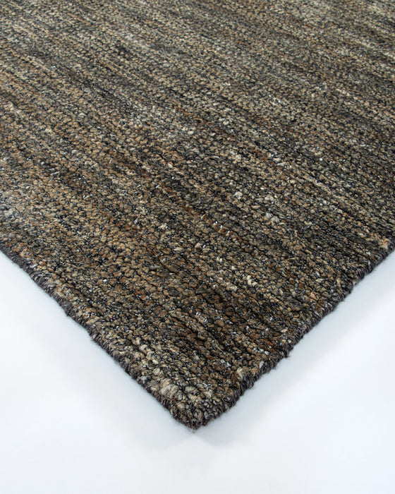 Fairbanks Floor Rug in Fossil, close-up of a corner showing the edge and viscose and jute pile
