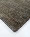 Fairbanks Floor Rug in Fossil, close-up of a corner showing the edge and viscose and jute pile