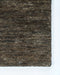 Fairbanks Floor Rug in Fossil, close-up of a corner showing the edge and viscose and jute pile