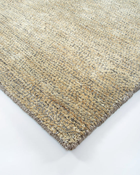 Fairbanks Floor Rug in Limestone, close-up of a corner showing the edge and viscose and jute pile