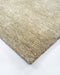 Fairbanks Floor Rug in Limestone, close-up of a corner showing the edge and viscose and jute pile