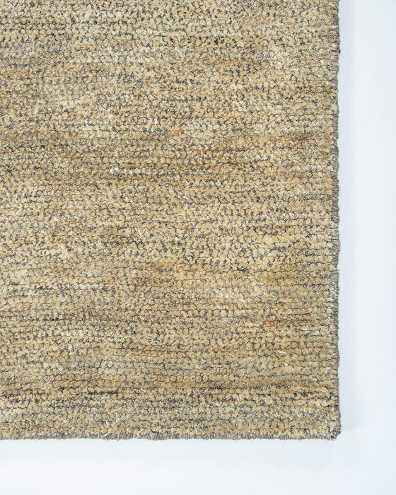 Fairbanks Floor Rug in Limestone, close-up of a corner showing the edge and viscose and jute pile