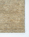 Fairbanks Floor Rug in Limestone, close-up of a corner showing the edge and viscose and jute pile