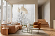 Tepih Dune Rug in Oatmeal, styled in a living room with a tan leather sofa and round coffee tables