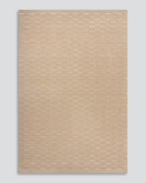 Hugo Floor Rug in Almond, the whole rug shown flat on a plain background