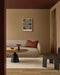 Hugo Floor Rug in Almond, in a living room with a curved cream sofa and round black coffee table
