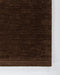 Hugo Floor Rug in Espresso, close-up of a corner showing the edge and wool pile