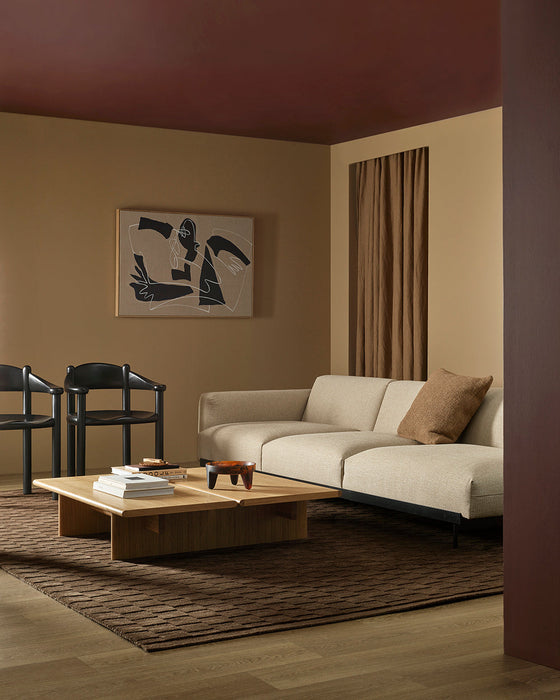 Hugo Floor Rug in Espresso, in a living room with a cream sofa, timber coffee table and black dining chairs