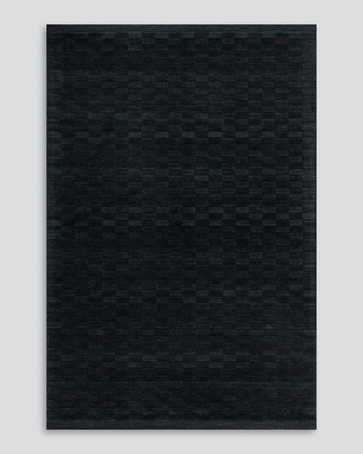 Hugo Floor Rug in Midnight, the whole rug shown flat on a plain background
