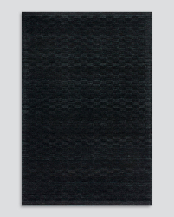 Hugo Floor Rug in Midnight, the whole rug shown flat on a plain background